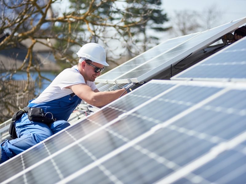 installing-solar-photovoltaic-panel-system-on-roof-of-house.jpg